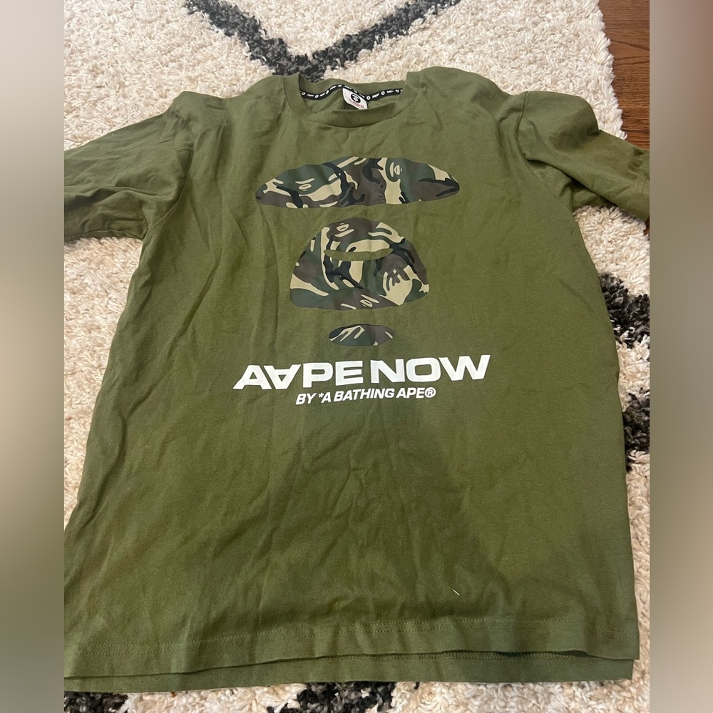 Aape shirt size xl fits like a large.